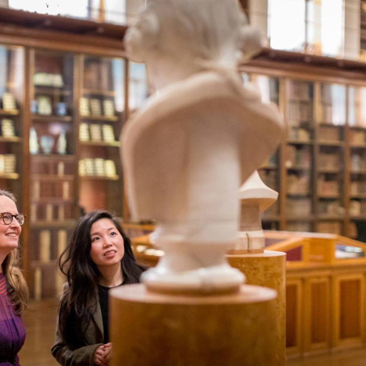 Two Advisory Council Members looking at a bust in the Enlightenment gallery