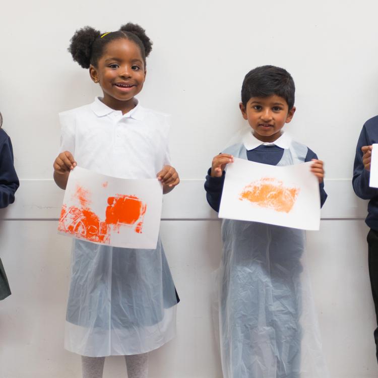 Students with their artwork for printmaking