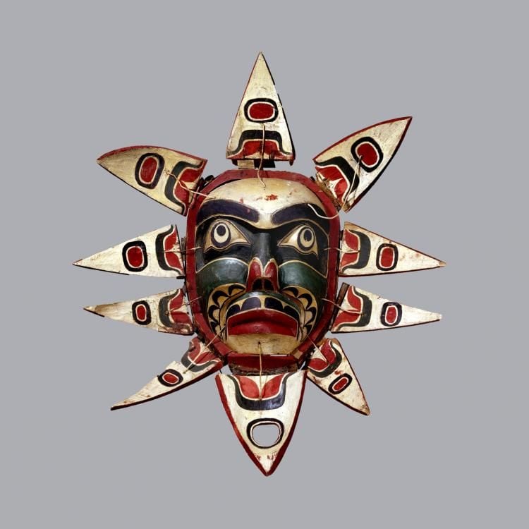 Mask for human, with face and flower like petals around it. 