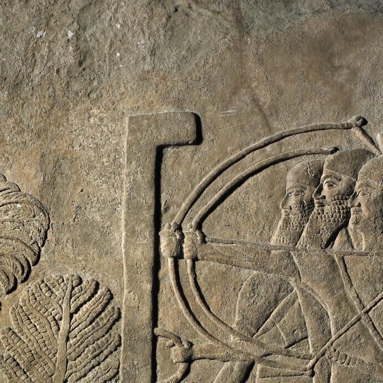 Row of three Assyrian soldiers, two with bows poised