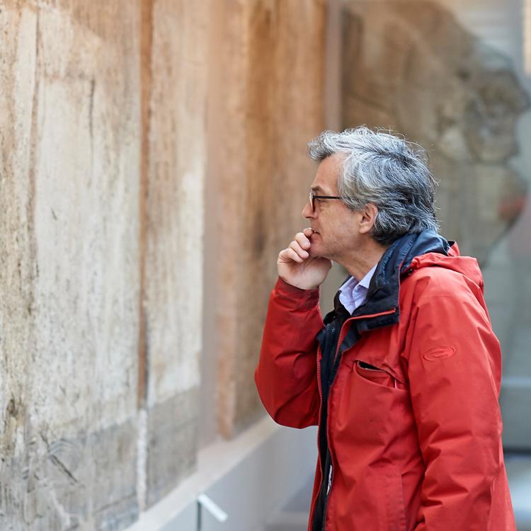 Visitors studying the wall reliefs from the palace of Ashurnasirpal II in Rooms 7–8