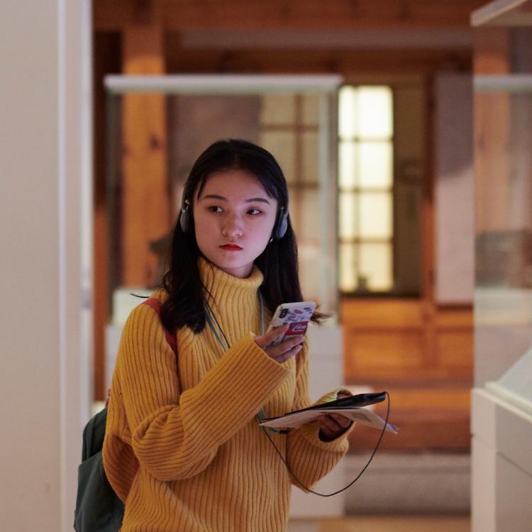 Visitor looking at the displays in Room 67