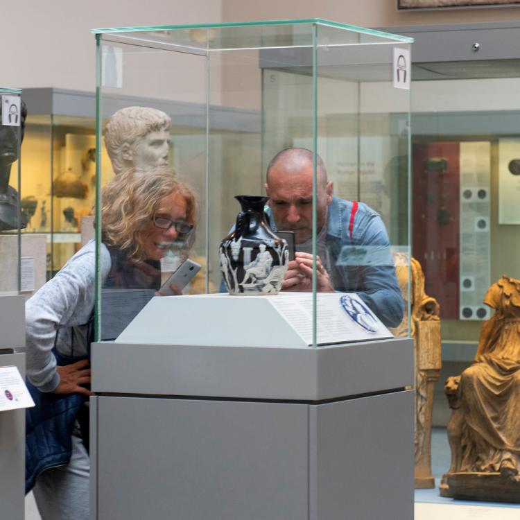 Visitors in Room 70 photographing the Portland Vase