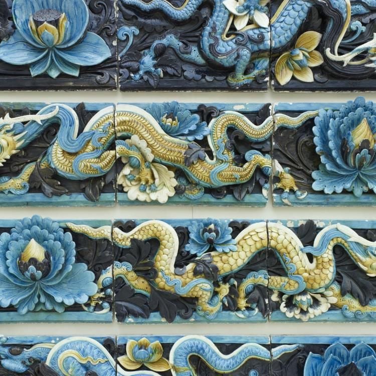 Stoneware tile, showing lotus flowers and dragons