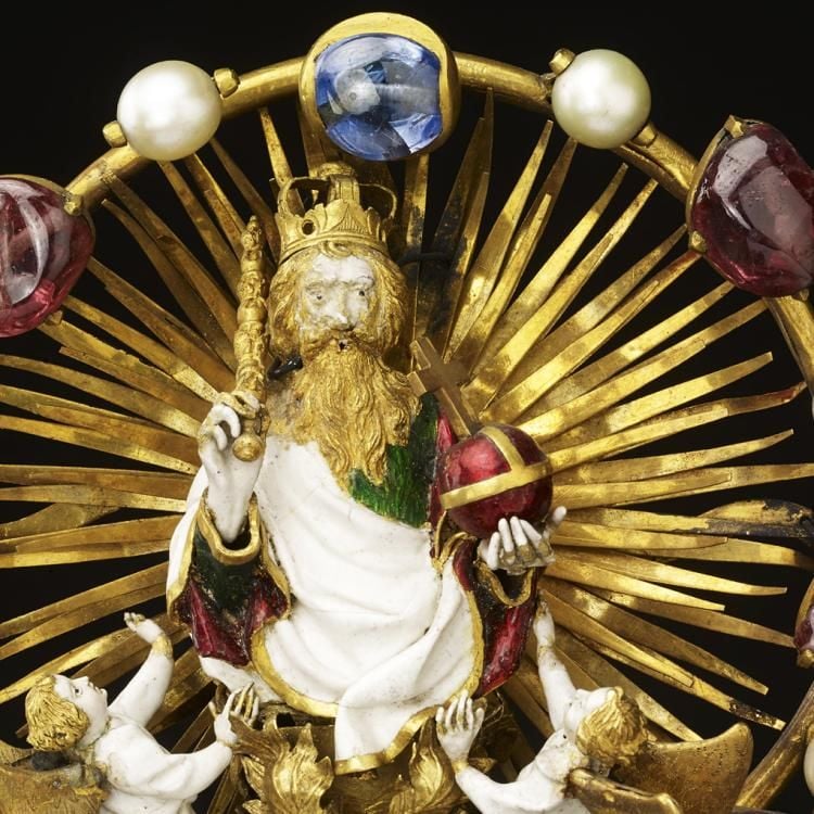 Reliquary of gold, richly enamelled and set with rubies, pearls and sapphires.