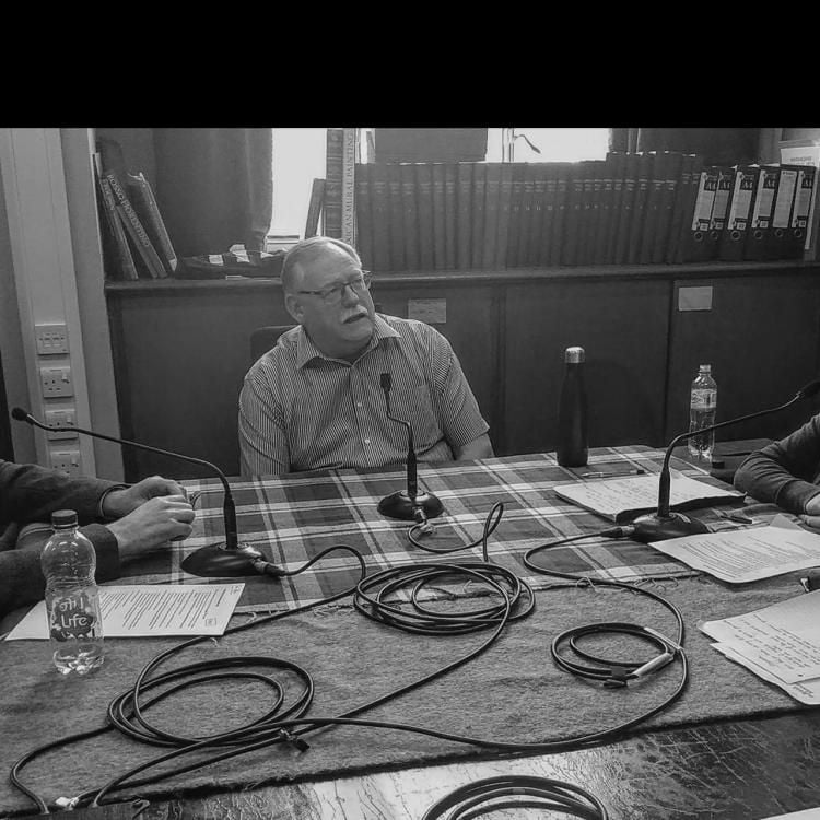 Hugo Chapman (left) and Sushma Jansari (right) with Nick Kendall (centre) sitting at a table