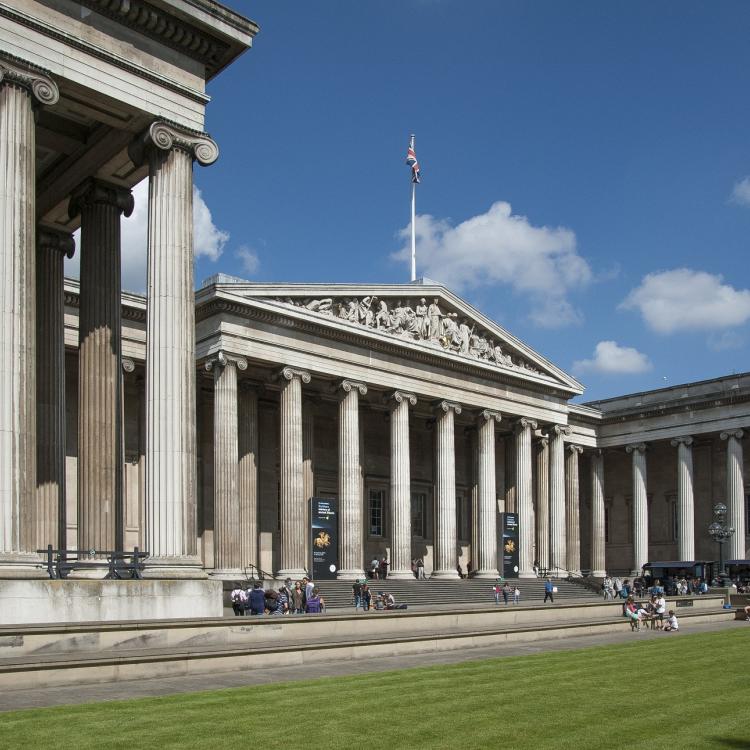 A photograph of the British Museum entrance during summer. 