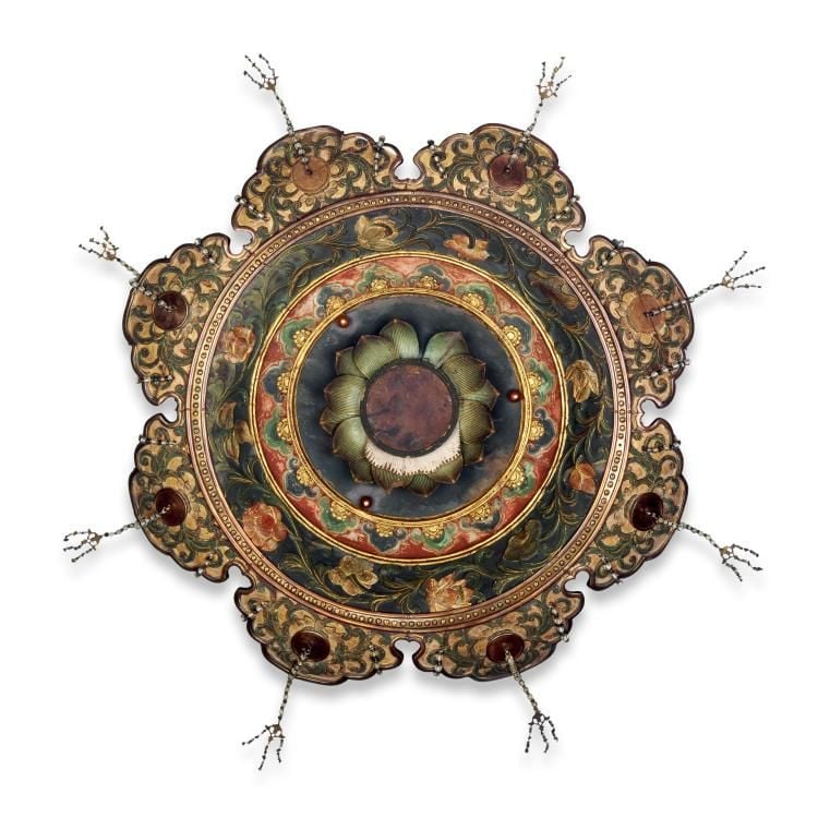 A green storage box in shape of 8-lobed lotus flower.
