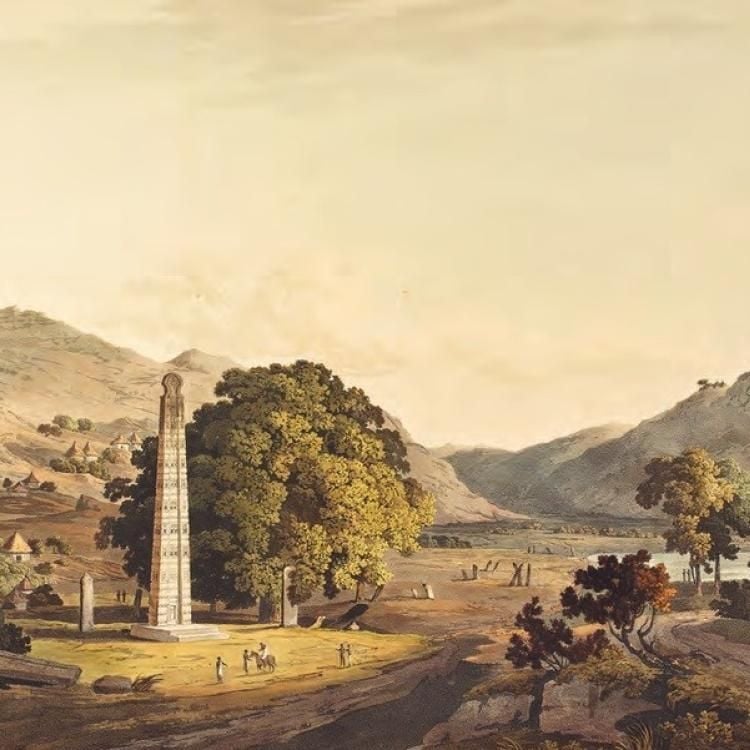 Hand-coloured aquatint depicting an obelisk beside a spreading tree in a flat landscape between low hills