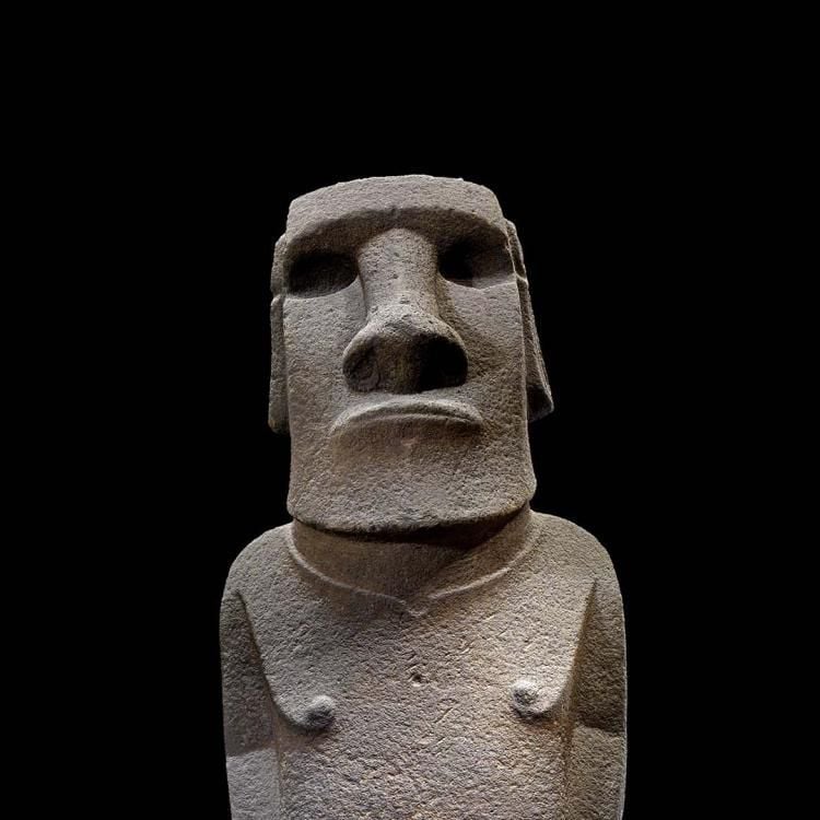 Face and shoulders of ancestor figure carved from basalt. 