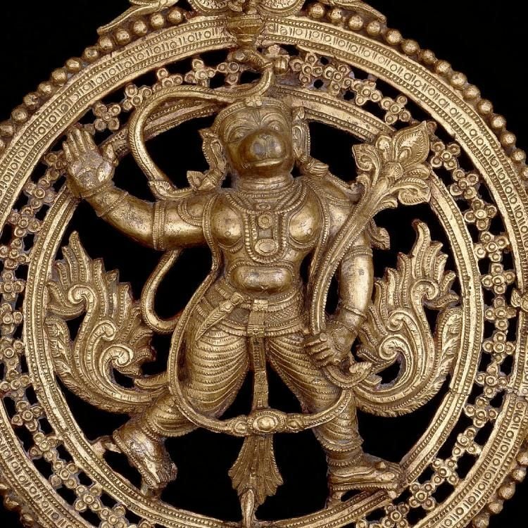 Circular plaque depicting a striding Hanuman, who is carrying in his left hand the magic plant which will cure Lakshmana