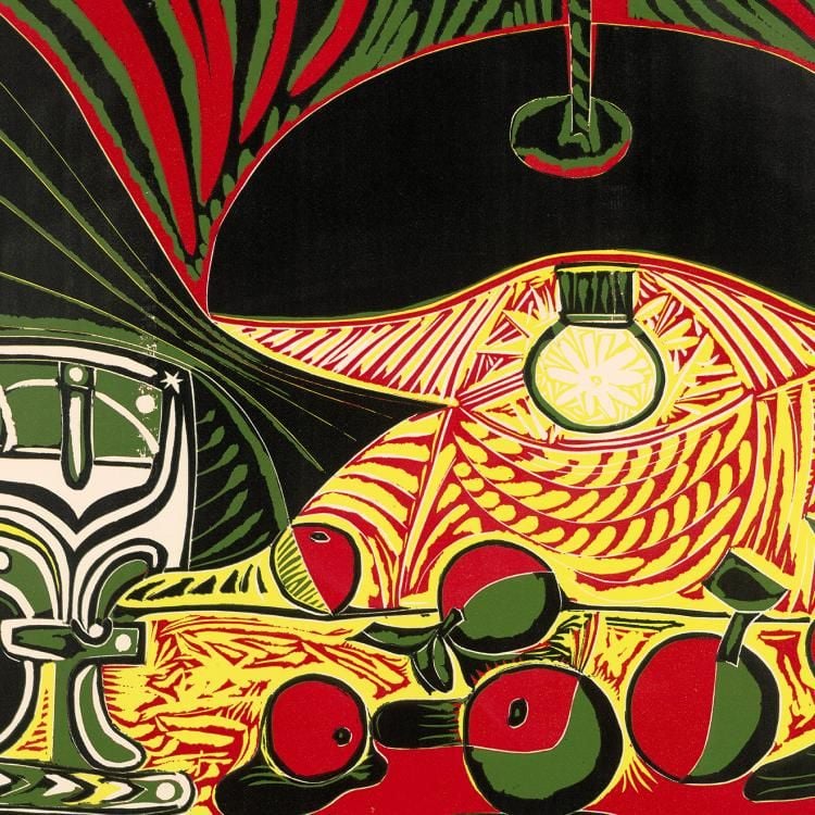 A colourful Picasso print in red, green, yellow and black showing a lightbulb from a ceiling lamp lighting up a table with apples and a goblet on it.