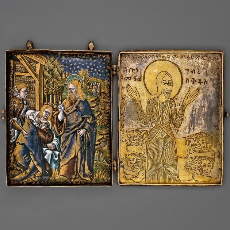 Two open panels of a diptych containing religious imagery.