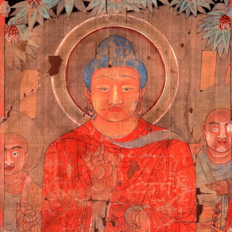 A colourful silk painting of the Buddha, sitting cross-legged with other religious figures in the background.