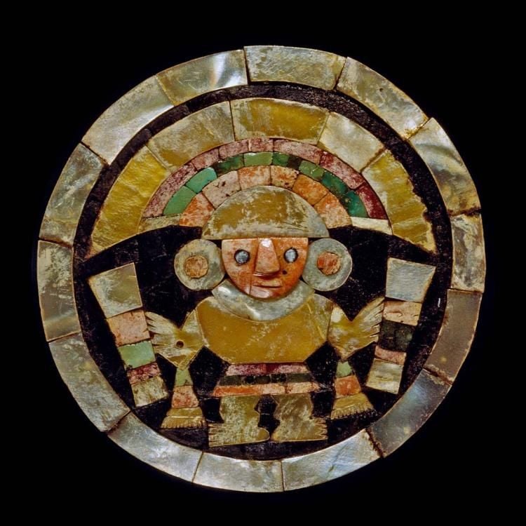  Ear plug made with mother-of-pearl and shell inlays, with an image of a face wearing large ear plugs