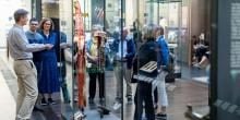 Seven visitors on a tour in the Islamic World Gallery.