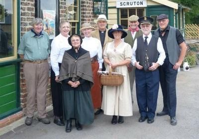 Group of volunteers wearing period costume