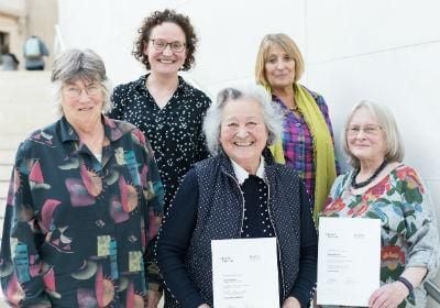 Group of winners with certificates