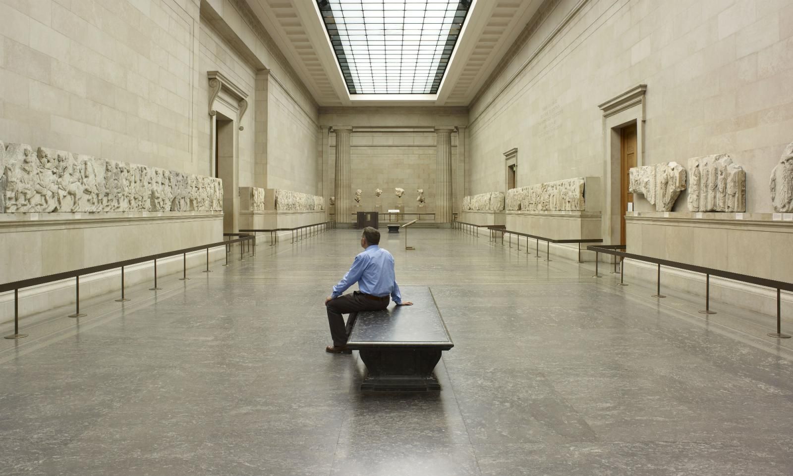 Man sitting in empty Parthenon Gallery