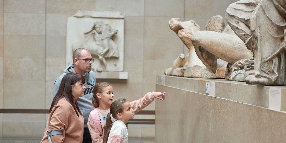 Family exploring Parthenon gallery