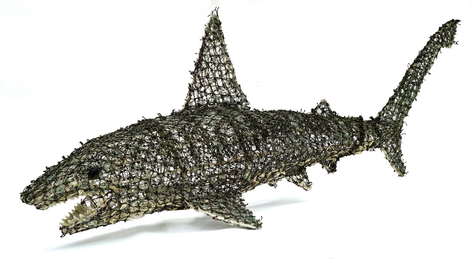 model of a shark made out of discarded fishing nets