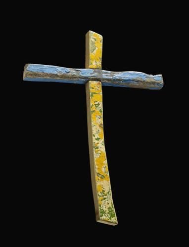 Wooden cross of Latin type made from pieces of a boat that was wrecked off the coast of Lampedusa, Italy on 11 October, 2013. The vertical and horiziontal pieces are joined with a cross halved joint. The cross piece retains scuffed blue paint on the front, upper and lower surfaces. The front of the vertical section has layers of damaged paint. 