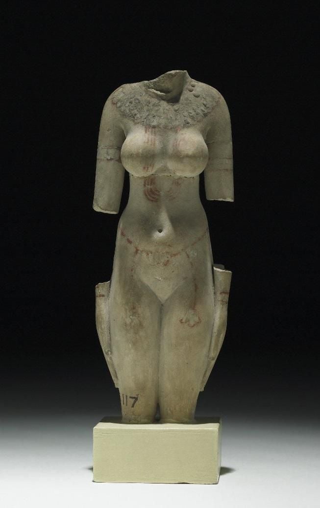 Limestone headless figureine 
