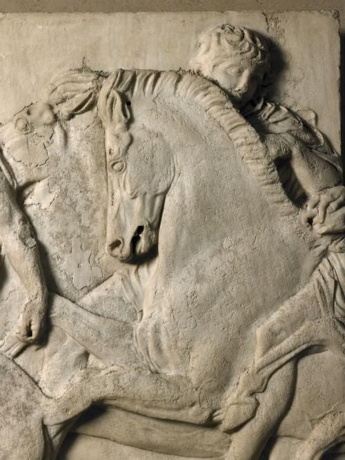 Marble relief, detail showing rider and horses