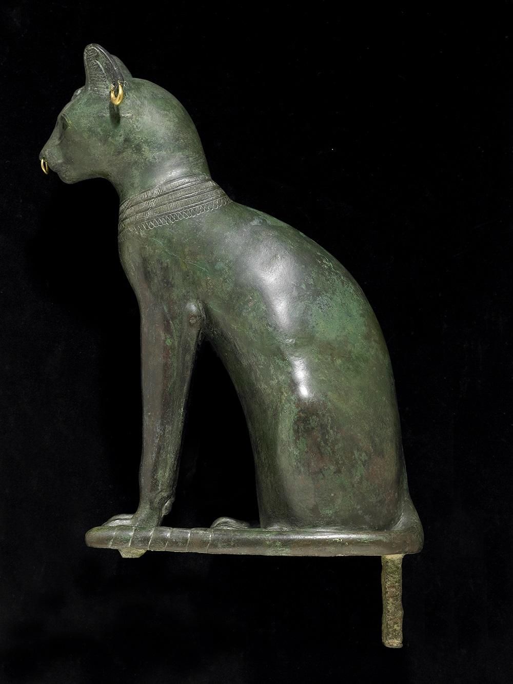 Hollow-cast bronze figure of the Gayer-Anderson cat, with a wedjat-eye pectoral on the chest, golden earrings and a nose-ring.