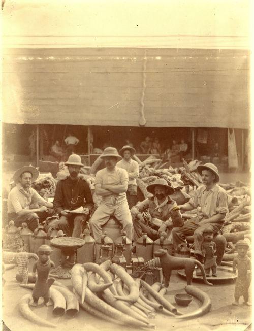British soldiers surrounded by looted objects
