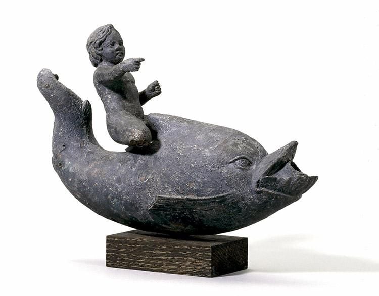 Bronze plastic lamp in the form of Eros riding a dolphin.