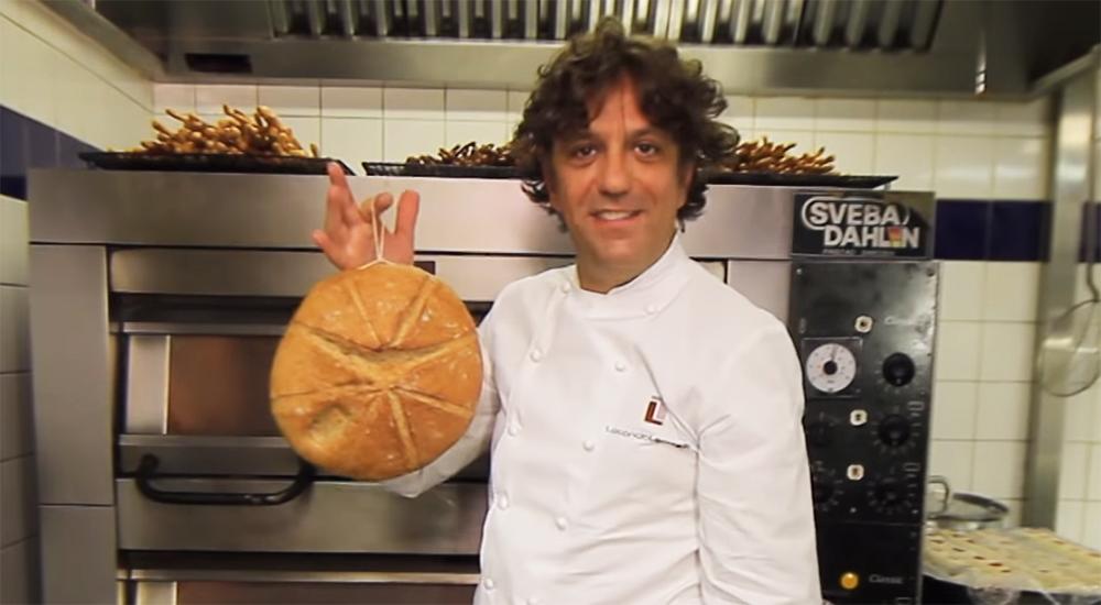 Chef Giorgio Locatelli holding a loaf of bread