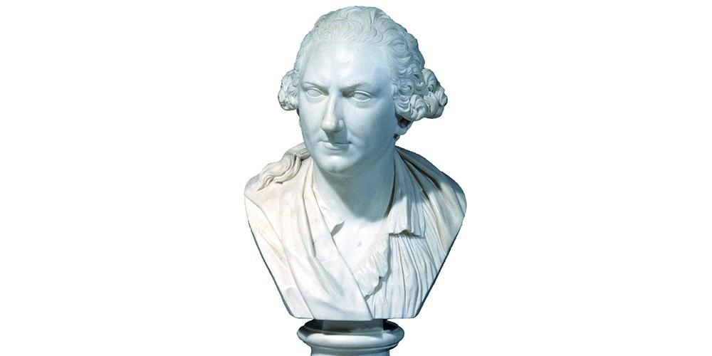 Marble portrait bust of Charles Townley, facing slightly to right, wearing a wig and a shirt.