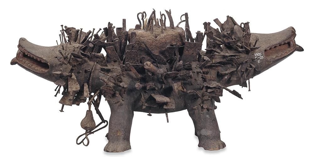 Two-headed dog made of wood, nails, iron and wire.