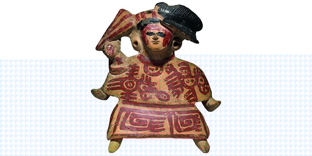 Pottery whistle in the form of a figure with red painted designs on the front of the body.