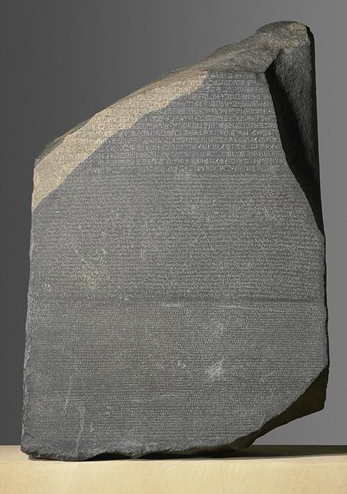 Part of grey and pink granodiorite stela bearing priestly decree in Hieroglyphic, Demotic and Greek.