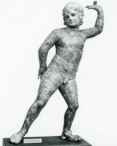 Bronze statuette of a boy, perhaps Cupid, dancing.