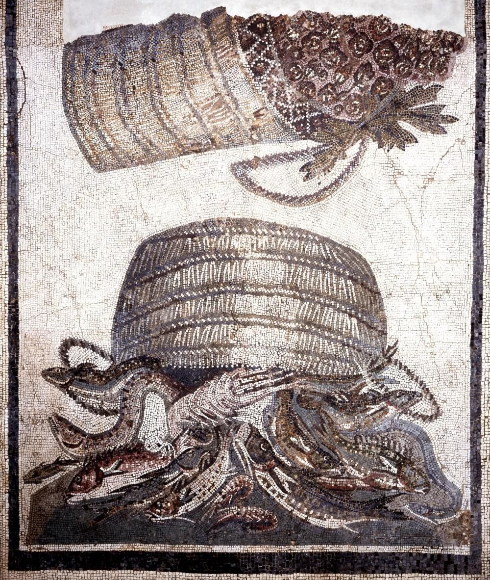 Upturned basket with fish spilling out, basket above, sideways with fruit in