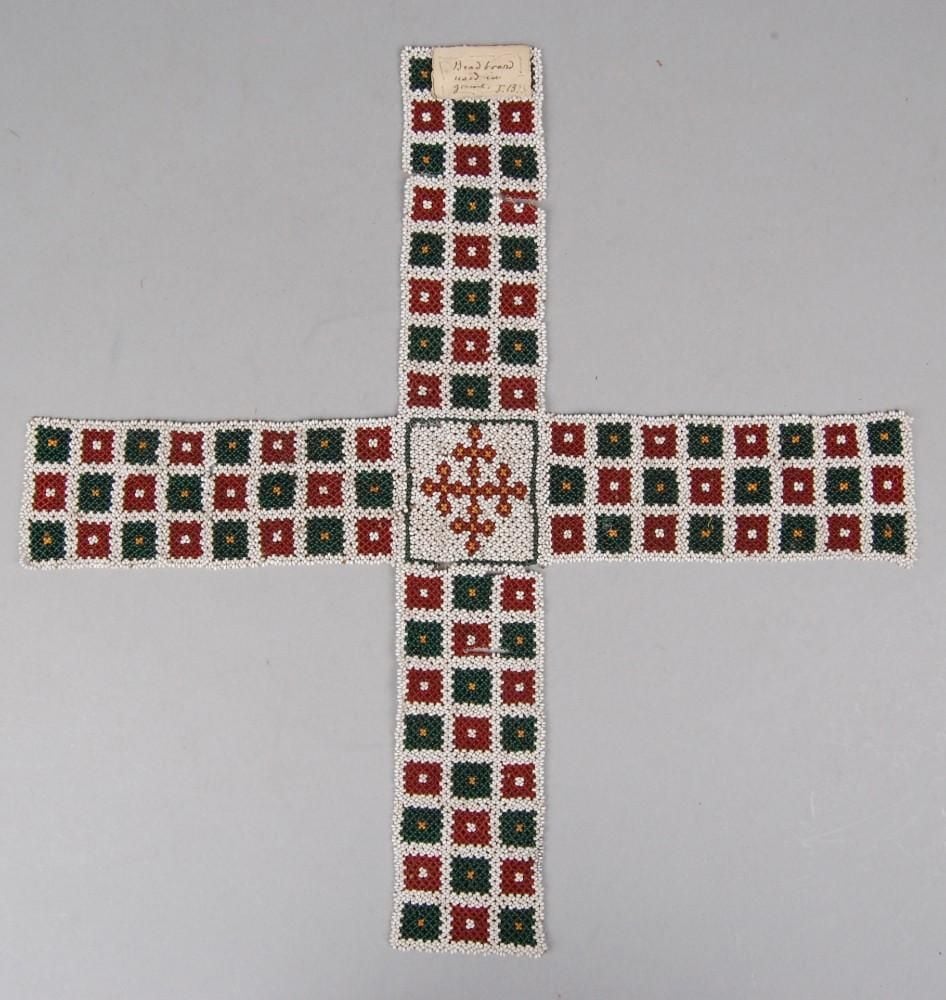 Beadwork gaming board, cruciform with arms of equal length. Each arm has twenty-four coloured squares arranged in three rows