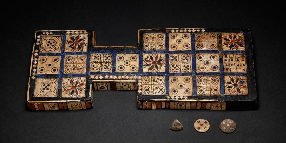 Game consisting of squares with different patterns and game pieces