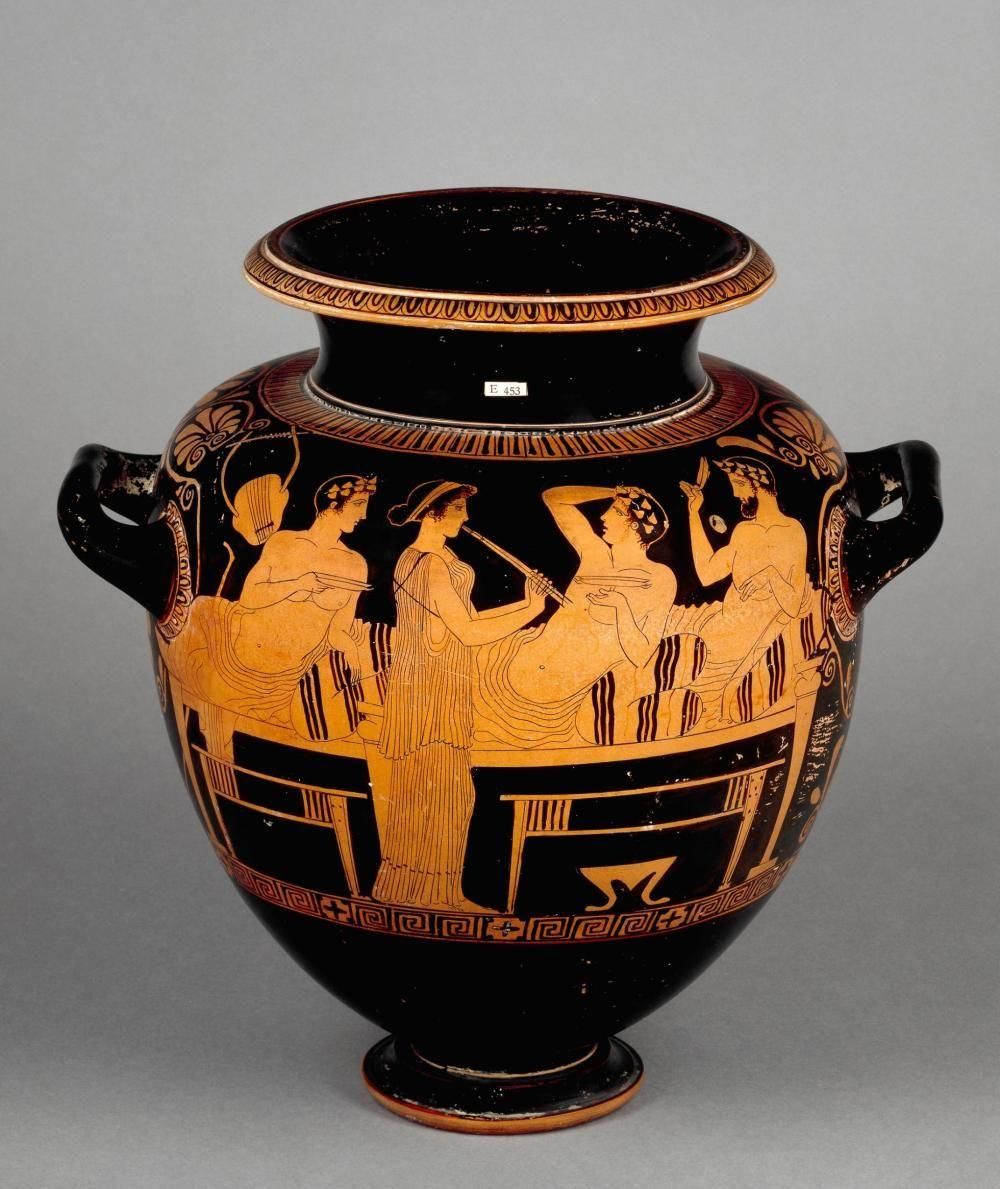  Red-figured stamnos depicting symposion, central standing figure plays a flute, flanked by three reclining figures