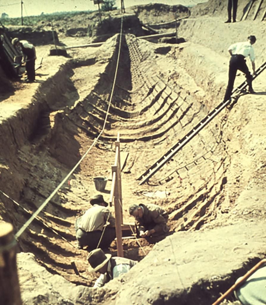 Archaeologists inside the imprint of the ship