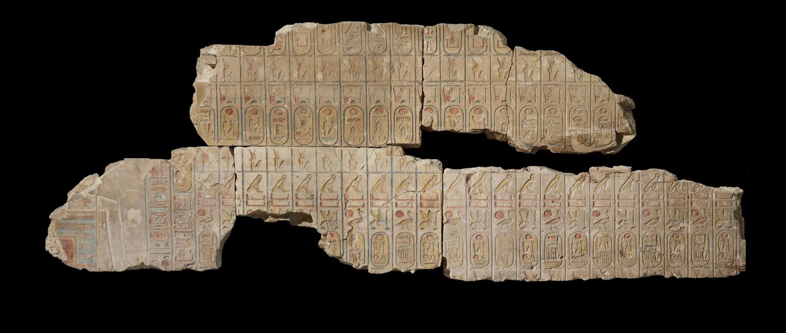 Part of a relief with Egyptian hieroglyphs on it. Part of the relief is broken off. 