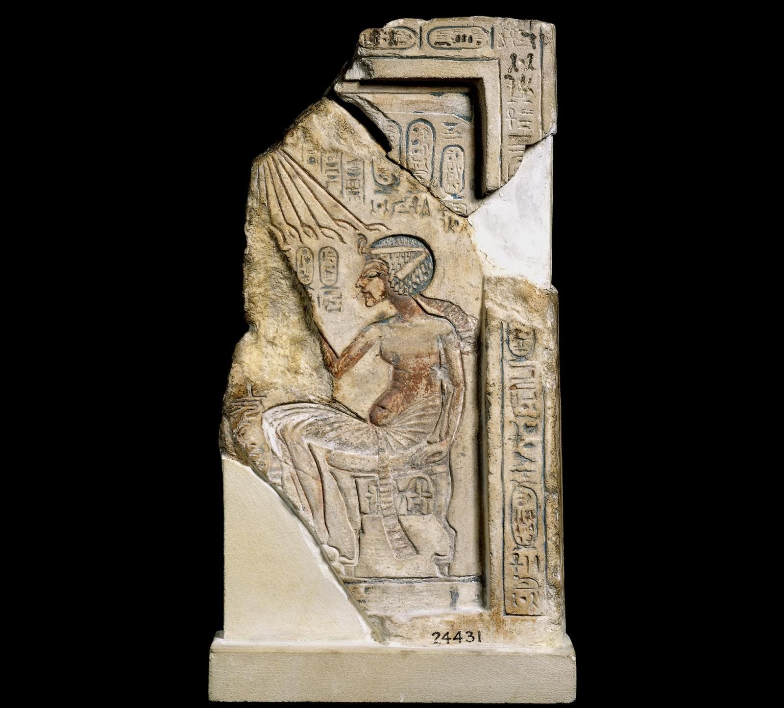 A stela of a Egyptian king sitting. 