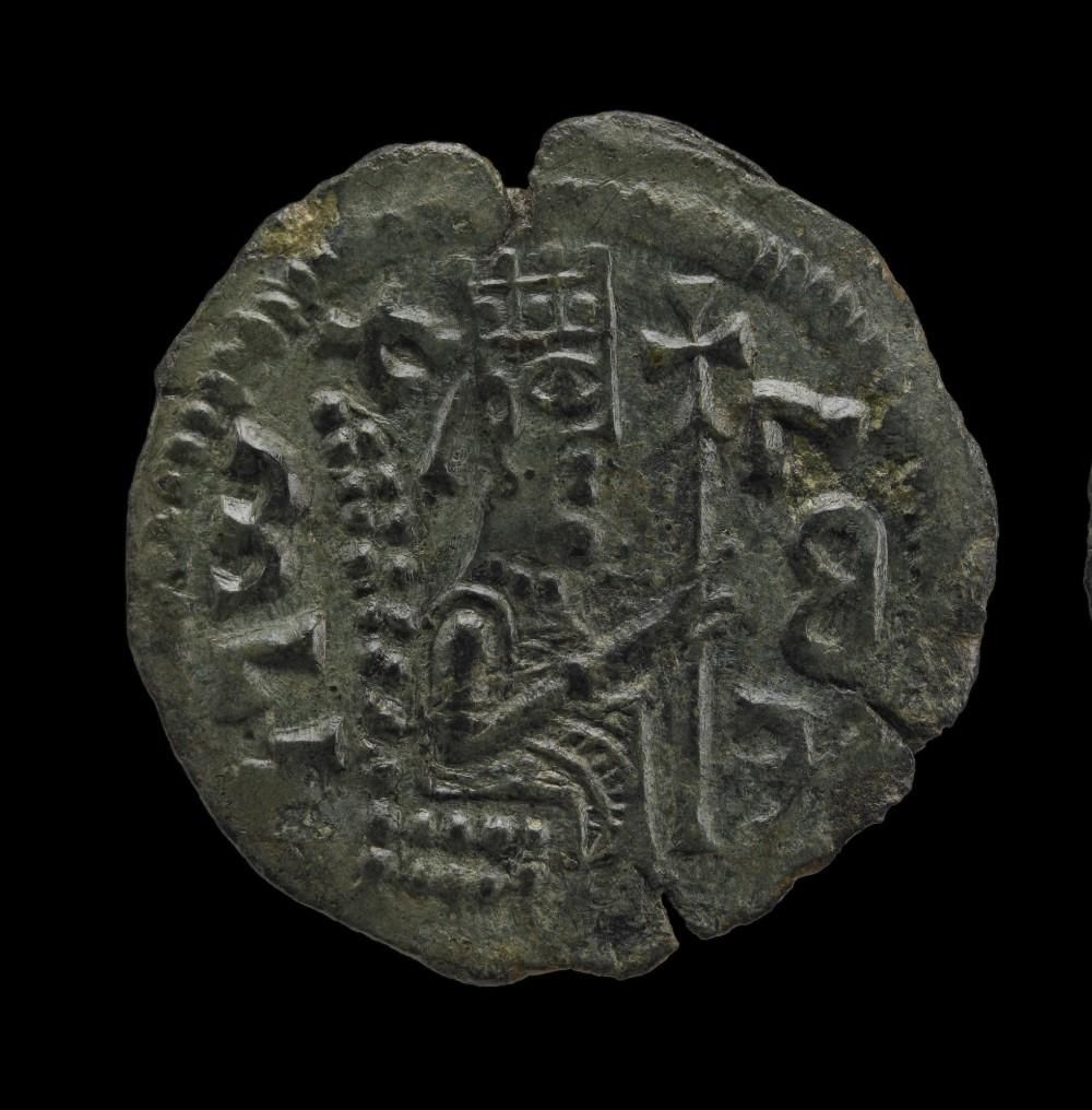 Coin with full length figure seated on high-backed chair, crowned and holding a long staff topped with a cross