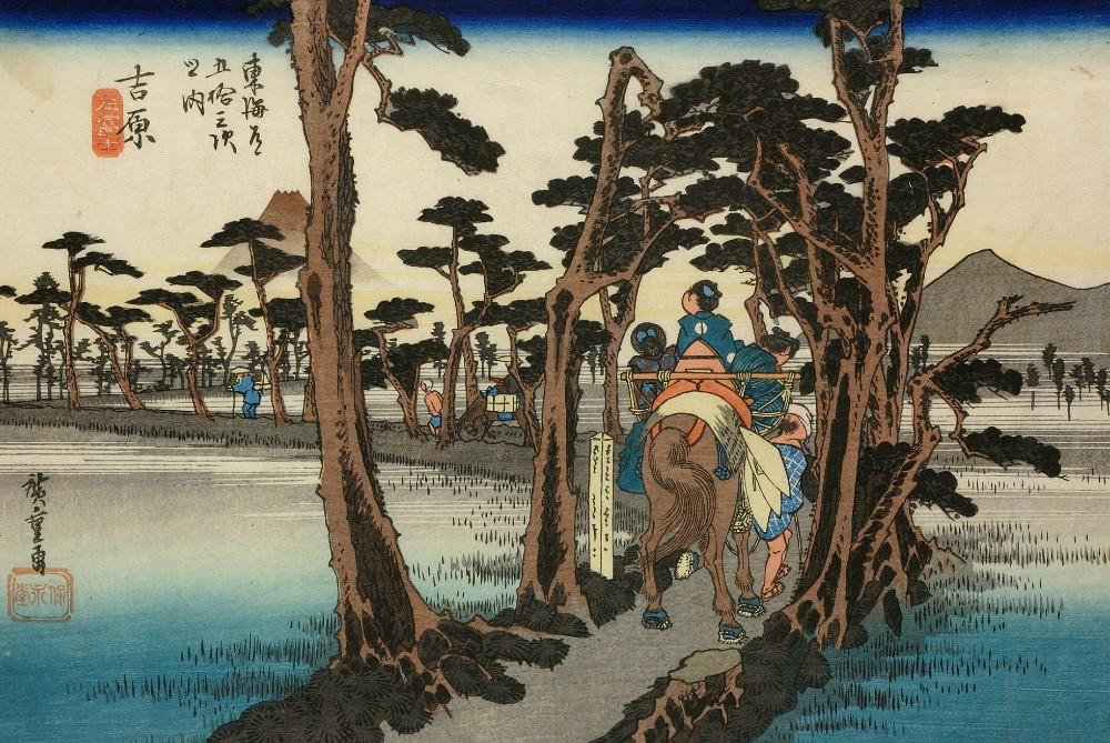 Colour woodblock print. Young samurai on horseback riding along cryptomeria-lined road around sunset, with Mt Fuji on the left and misty village in distance.