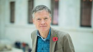 Headshot of Daniel Dodd standing in the Great Court