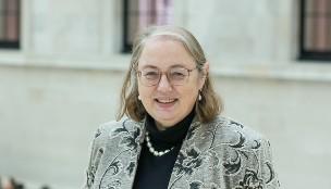 Headshot of Lisa Hopkins standing in the Great Court