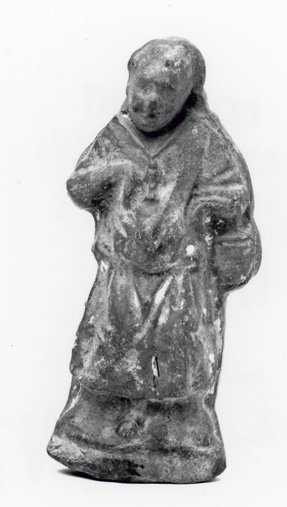 Figure of a priest with hand bent at wrist