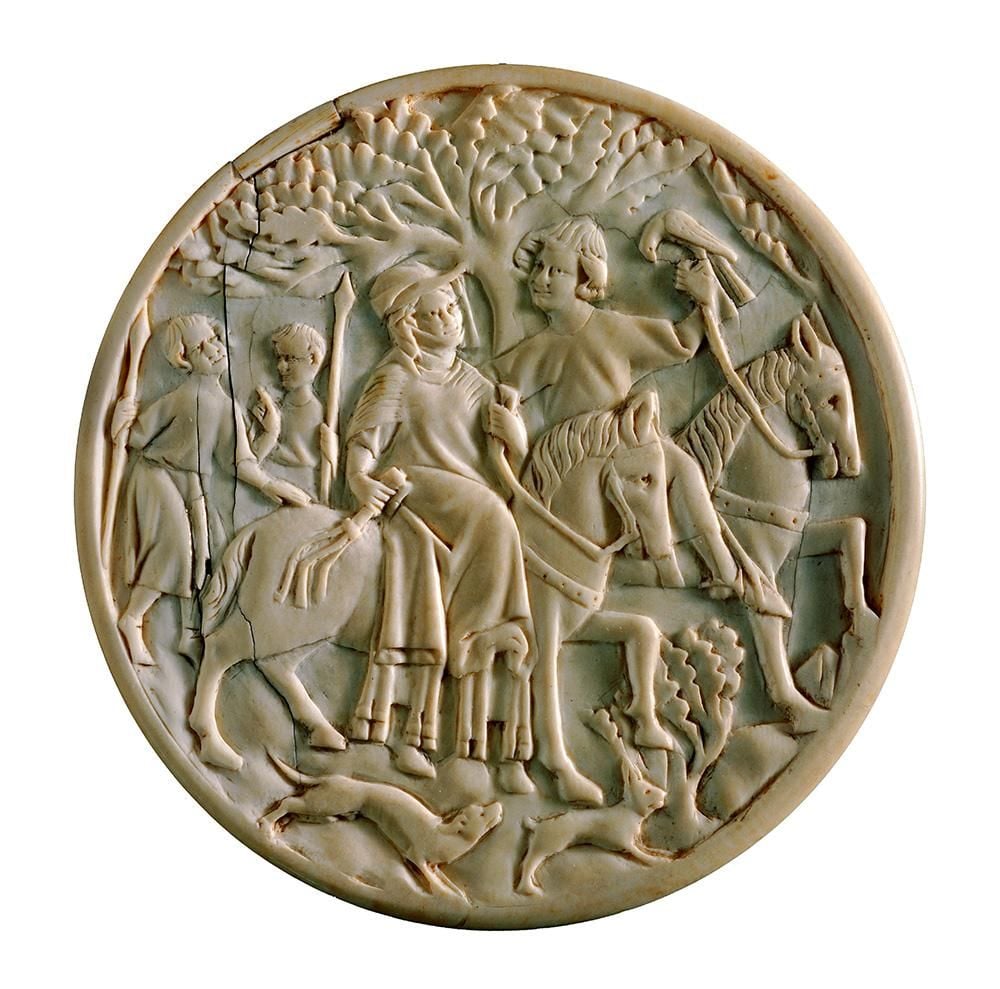 Mirror case made of ivory or bone engraved with a scene of a man and woman hunting on horseback, with two attendants carrying spears and a tree visible behind